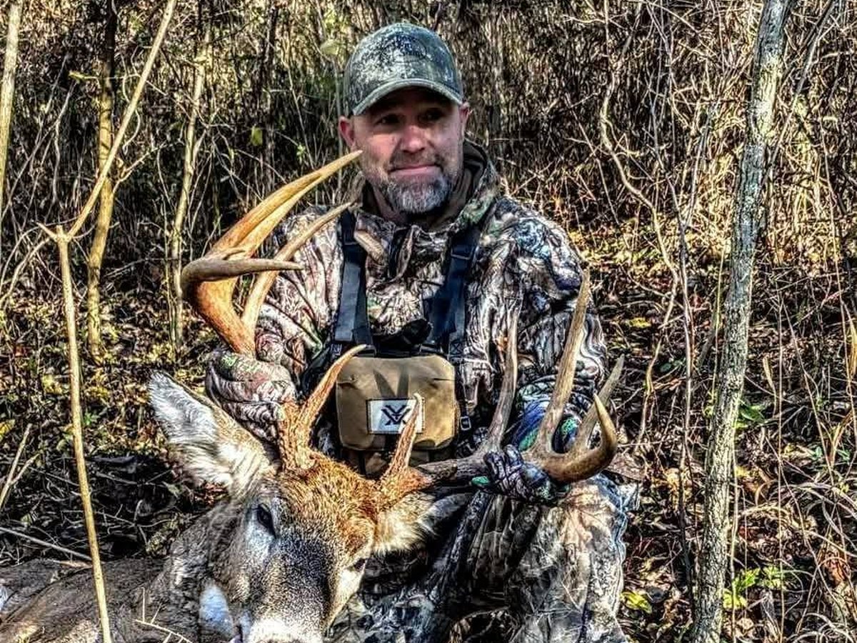 Hunter with a mature Ohio buck taken during the peak of the rut