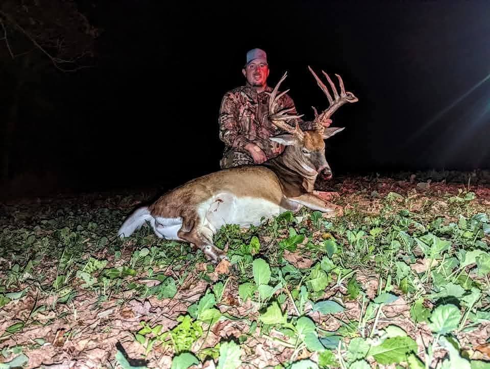Hunter with a mature Ohio whitetail buck at 1st Class Whitetails